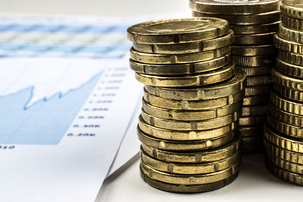 Investment chart and coins